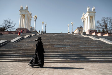 plague doctor in front of the stairs to the top