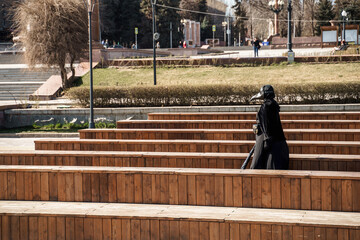 plague doctor in an empty city park