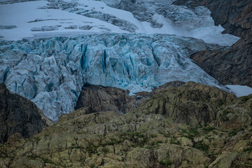 Glacier ice with rocks around it