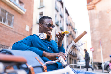 Black Man Recording Audio Using Cellphone Outdoors.