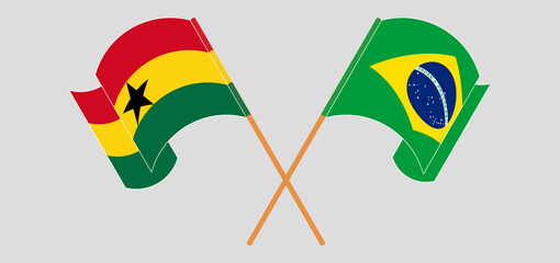 Crossed and waving flags of Ghana and Brazil
