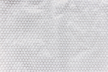 Light gray bubble foil for wrapping. Close up, texture background, polution concept