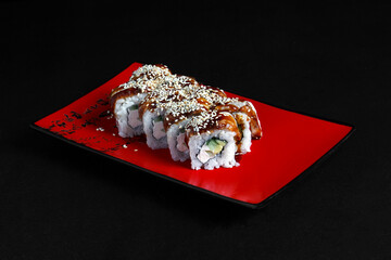 Asian cuisine dish, delicious sushi, sushi on a black background, roll you net on a black background