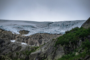 Buerbreen glacier with rocks around it