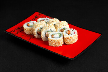 Asian cuisine dish, delicious sushi, sushi on a black background, roll you net on a black background