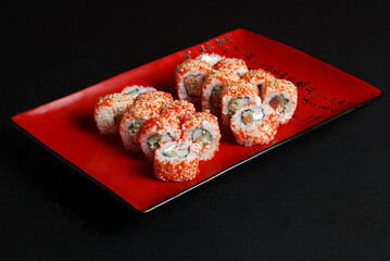 Asian cuisine dish, delicious sushi, sushi on a black background, roll you net on a black background