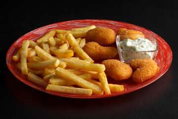 french fries with nuggets and sauce, potatoes with nuggets and sauce