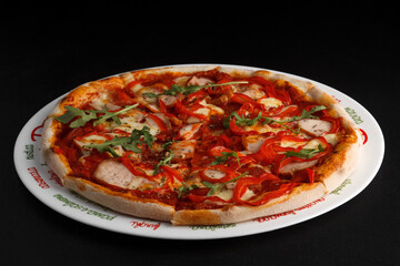fragrant and hot pizza on a dark background