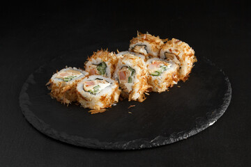 Asian cuisine dish, delicious sushi, sushi on a black background, roll you net on a black background,