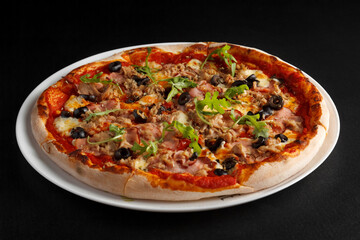 fragrant and hot pizza on a dark background