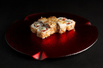 Asian cuisine dish, delicious sushi, sushi on a black background, roll you net on a black background,