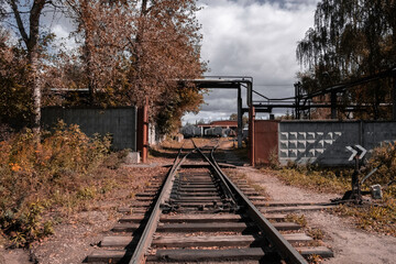 Old wagons on the railway tracks of an abandoned factory