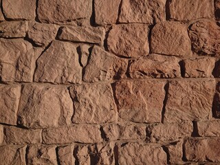Masonry stone wall texture. Stones in the foundation. Stone wall background for design or illustration