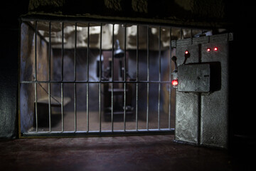 Jail or prison cell. Obsolete gray grunge concrete room. Old prison miniature. Execution concept