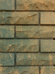 Solid piece of beige brick wall. brickwork for background or texture, dark spots on brickwork