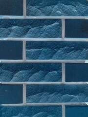 Seamless fragment of a blue brick wall. brickwork for the background or texture. taken in inversion mode