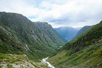 Fototapeta na wymiar River from the Buerbreen glacier down to the valley in Norway
