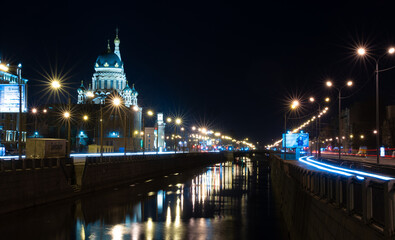 Fototapeta na wymiar Night City Lights From Cars Canal