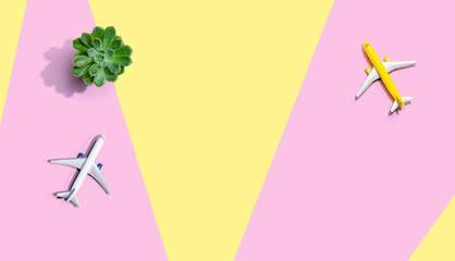 Travel theme with miniature airplane from above