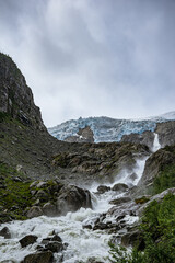 Buerbreen glacier with the river in Norway