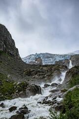 Fototapeta na wymiar Buerbreen glacier with the river in Norway