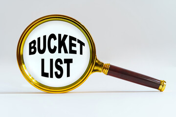 Magnifier on a white background, inside the text is written - BUCKET LIST
