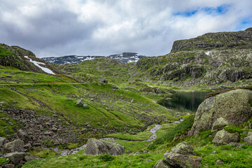 Fototapeta na wymiar Rocky landscape with snow fields in Norway
