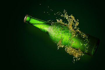 Green beer bottle with long neck in splash of beer.