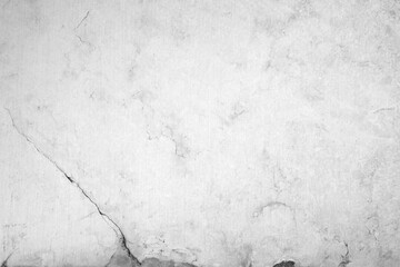 Close-up of an aged and cracked smooth natural marble stone wall or flooring. High resolution full frame textured background in black and white.
