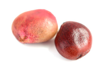 Closeup on Whole Dry Sumac Berry Seeds (Rhus). Isolated on White Background.