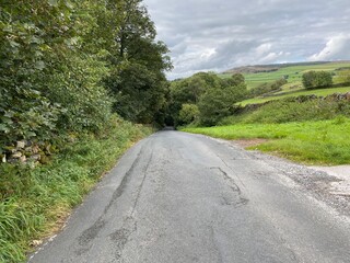 Landscape view of the countryside from, Carr Lane, with trees and hills in the distance near, East Morton, Keighley, UK