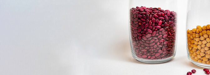 Red beans in a glass transparent jar and part of a jar with peas banner business