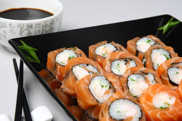 Japanese Food Sushi Set in Black Plate on the Table
