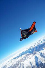 Wingsuit flier glides over Swiss Alps