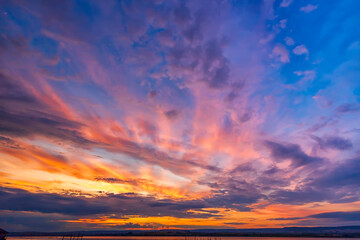 Amazing colorful clouds at the sky. Amazing view on the dramatic sunset sky