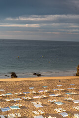 Sun beds on the beach. Early morning, no people. Lagos, Algarve Coast, Portugal