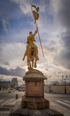 Obraz premium Paris,France - 12 30 2020: The Statue of Joan of Arc Paris from Pyramids Square at sunset