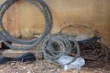 Rolls of used barbed wire used for building cattle fences