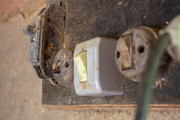 Very old electric switches and sockets of an old farm