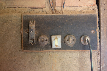 Very old electric switches and sockets of an old farm