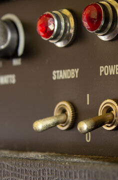 Buttons, knobs and lights of a guitar amplifier