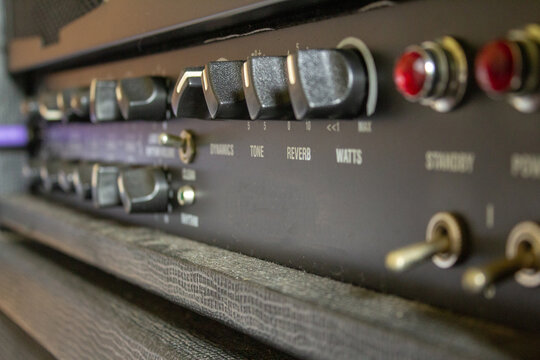 Buttons, knobs and lights of a guitar amplifier