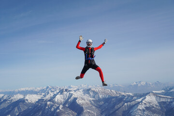 Skydivers perform stunts over Swiss Alps