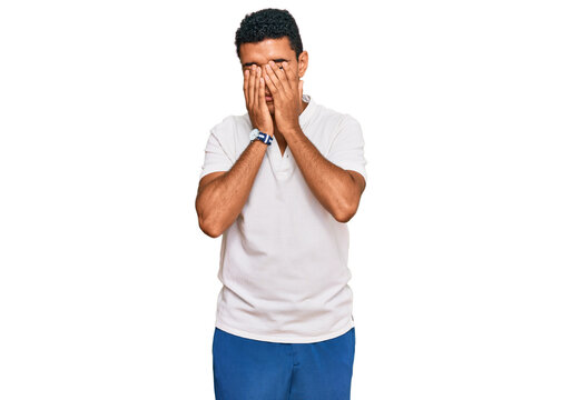 Young arab man wearing casual clothes rubbing eyes for fatigue and headache, sleepy and tired expression. vision problem