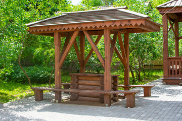 Naklejka premium Wooden water well in summer time. Village water well view. Rural water well 