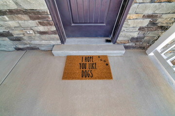 I hope you like dogs doormat at the doorstep of home with gray front door