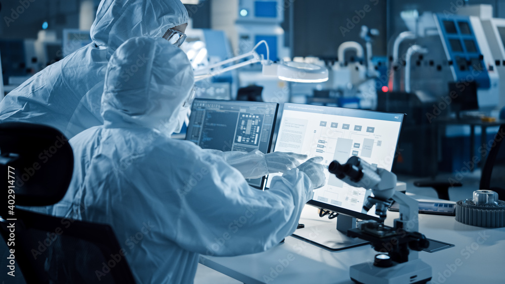 Poster Research Factory Cleanroom: Engineer and Scientist Wearing Coveralls Talk and Work on Computer, Use Microscope to Inspect Motherboard Microprocessor, Develop Electronics for Medical Electronics