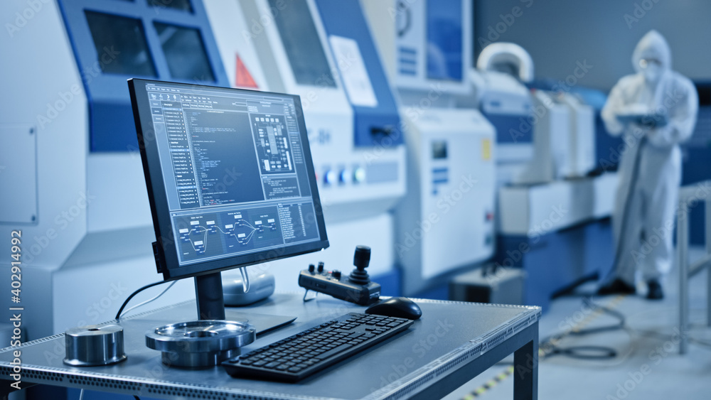 Aufkleber Factory Cleanroom: On the Desk Personal Computer Showing Infrastructure System Control on its Display. In Background CNC Machinery, Professionals Use Robot Arm on Production Line.