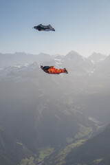 Wingsuit fliers glide over Swiss Alps
