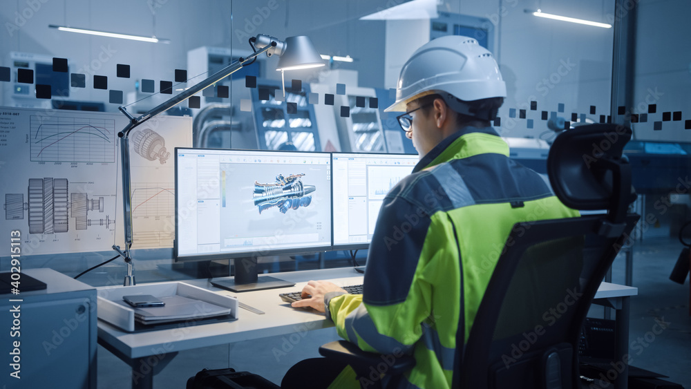 Poster Modern Factory with Professional CNC Machinery. In-Office: Male Engineer in Safety Vest and Hardhat Works on Computer and working with CAD Software, Creating New Eco-Friendly Jet Engine.